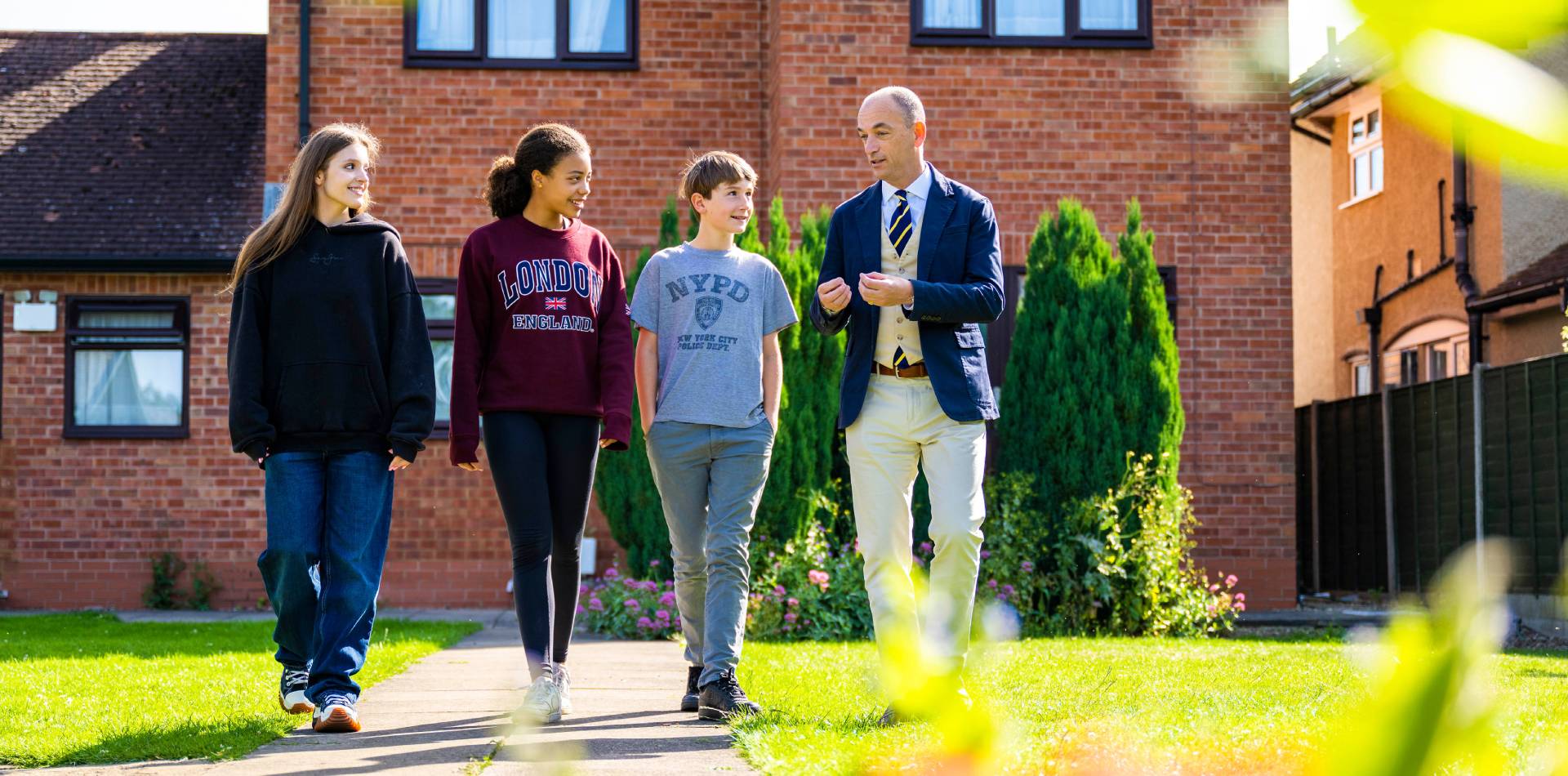 Ian Smith, Principal of Brooke House, with students.